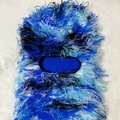 Detailed view of blue knitted balaclava featuring fringed tassel textures and blue camouflage pattern - One Size / Camo Blue