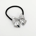 Detail of high-elastic black hair tie featuring a polished silver alloy bow decoration - Silver Crinkle