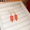 Macro shot of red tassel firecracker earrings in a premium jewelry display box - Firecracker Small Pendant Style (66#) / Red/Gold