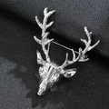 Elegant men's reindeer head brooch in polished silver metal on black leather background - Silver Metal Deer