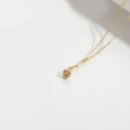 Elegant gold rose necklace with a red floral pendant on a minimalist white background - Rose Style / Pink Zirconia Rose