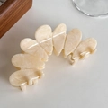 Elegant beige acetate hair claw clip with marble texture and round petal design - Off White