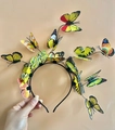 Detailed view of hand-held LED 3D butterfly headband with colorful vibrant decorations - Yellow Butterfly Headband (14 Butterflies)