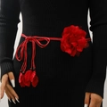 Bohemian red woven waist belt with 3D floral decoration on a black knit dress - Red