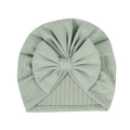 Macro detail of elastic ribbed knit newborn turban with a large soft decorative bow - Green