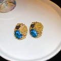 Macro shot of blue gemstone floral earrings with gold rose details on a white plate - Court Retro Blue Gem Rose Earrings (9#)