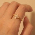 Adjustable gold flower ring with white oval gemstone and sparkling diamond accents - Gold French Cat Eye (JZ0807)