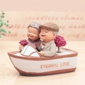 Elderly couple on a small boat music box figurine with Eternal Love engraving - Old Couple Figurine / 1041-11 Boat Music Box