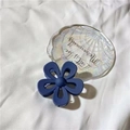 Navy blue jelly flower claw clip with matte finish on white fabric and shell tray - Matte Navy Blue