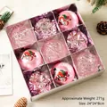 Set de 9 bolas de Navidad rosa con diseños de Papá Noel y texturas variadas en una caja - Rosa