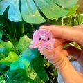 Mini translucent purple octopus hair claw with orange glitter accents and small black eyes - Octopus