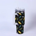 Detailed view of leaf pattern on a 40oz stainless steel tumbler with handle and straw - Autumn Leaves/Black