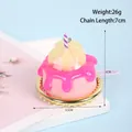 Roze miniatuur slagroomtaart sleutelhanger met geel fruit en gouden basis 26g - D01 Fruit Oranje Taart