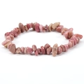 Macro view of pink natural irregular stone beads on a stretchy elastic bracelet - Pink Zebra Jasper