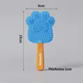 Cat paw-shaped pet massage comb in orange and blue silicone with circular massage teeth - Paw Popsicle Shape Cat Comb / Orange Blue