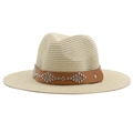 Detailed close-up of straw sun hat with brown leather band and silver metal rivets - Beige