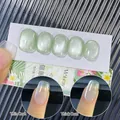 Light green cat-eye nail polish N10 showing thin and thick coat effects with magnetic shine - N10 Shallow Grass 7ml