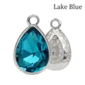 Lake Blue teardrop crystal pendant with silver setting and floral engraved back detail - Lake Blue