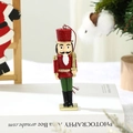 Detail of resin nutcracker soldier ornament with red rope and golden sword for Christmas tree - Nutcracker Soldier with Sword