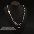 Double-layer silver star pendant necklace shown on a black mannequin for a luxury look - Silver