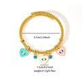 Detail of gold evil eye heart charms on a twisted stainless steel bangle with dimensions - Three-Color Heart Evil Eye Style (TYGB0159)