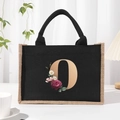 Black jute canvas tote bag with floral letter O print and comfortable handles - Bronze Floral Letter O