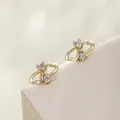 Elegant 14K gold plated heart stud earrings with sparkling white cubic zirconia stones - Side-by-side Heart (109)