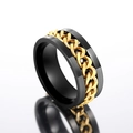 Detail of a rotating black matte metal ring with a gold Cuban link chain inlay - US 7 / Black + Gold