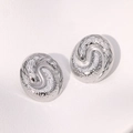 Pair of silver stainless steel conch stud earrings featuring snake relief and dot textures - Silver