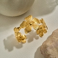 Elegant gold-tone open cuff bracelet featuring a detailed five-petal floral cluster design - Gold Floral Cluster