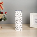 Close-up of a white 20oz stainless steel travel mug with silver cat and heart patterns - Cat Paw and Heart