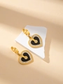 Elegante goldene Herzohrringe in Schwarz mit Diamanten auf einem Steinsockel - Ohrringe mit schwarzer Muschel