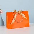 Elegant orange gift bag with golden silk bow and woven handle for luxury packaging - Orange; Horizontal Extra Small Size 19*15*7 Ribbon Style