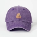 Detailed close-up of a purple washed denim baseball cap with a cute capybara embroidery - One Size / Dark Purple