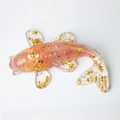 Pink resin koi fish figurine with gold foil flakes on a clean white background - Watermelon Quartz