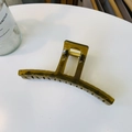 Detailed top view of large olive green hollow claw clip with golden metal spring - Jelly Yellow Green