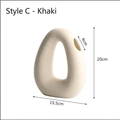 Modern abstract khaki ceramic donut vase with a hollow ring design and smooth clay finish - Earthy Yellow - Style C (Donut Shape)