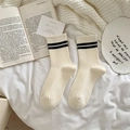 Soft white wool socks with black double stripes and knit texture shown on white linen - One Size / White with Black Double Stripes Cuff