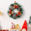 Artificial Christmas wreath with pine cones and red berries for holiday door decor - Three Large Knots Style