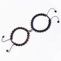 Detail of couple bracelets with magnetic heart clasp and adjustable natural stone beads - Red Tiger Eye + Matte Stone