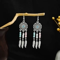 Detailed shot of Bohemian dreamcatcher earrings with blue rhinestones and metal feathers - E6109-3 Dreamcatcher Blue