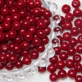 Close-up of 8mm glossy red frosted glass beads with pre-drilled holes for DIY jewelry - Solid Wine Red