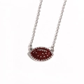 Detail of silver chain necklace with a red enamel American football pendant and silver studs - Rugby Ball / White Gold