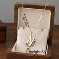 Titanium steel necklace in gold with letter N pendant displayed in a wooden jewelry box - Letter N / Gold