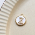 Close-up of gold-plated pendant with white shell inlay and zircon letter Z detail - Z Round