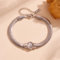 Polished silver stainless steel wide snake chain bracelet with an oval cat eye gemstone - Silver with White Cat Eye Stone