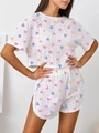 Close-up of eyelet embroidery fabric with colorful heart prints on summer loungewear - S / White (Colorful Heart Print)