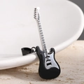 Detailed macro view of a 52mm guitar pendant in two-tone black and silver stainless steel - Steel Black 1 (No Chain)