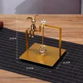 Golden square metal napkin holder featuring a sitting rabbit and crystal ball accent - Square Sitting Rabbit Style / Gold