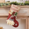 Calza natalizia rossa e beige con Babbo Natale e fiocchi di neve su legno di camino - Calza Patchwork Babbo Natale